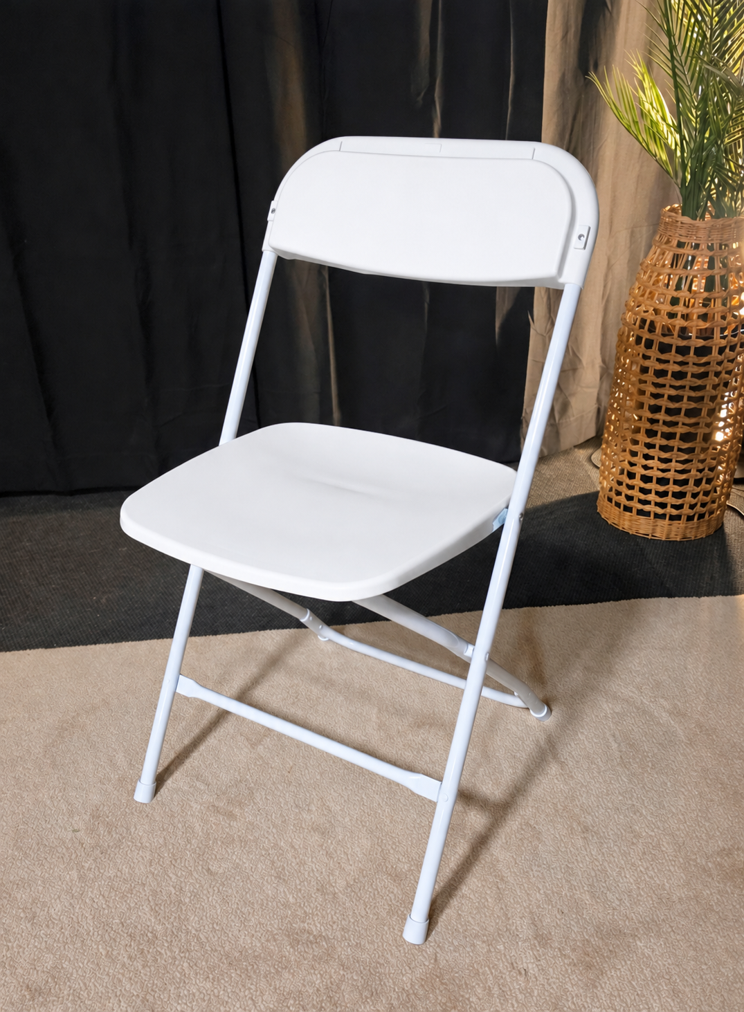 White plastic folding chair